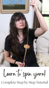 a woman spinning yarn with a drop spindle