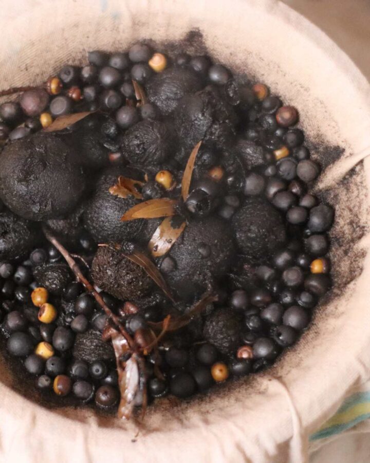 a pot of boiled acorns and walnuts