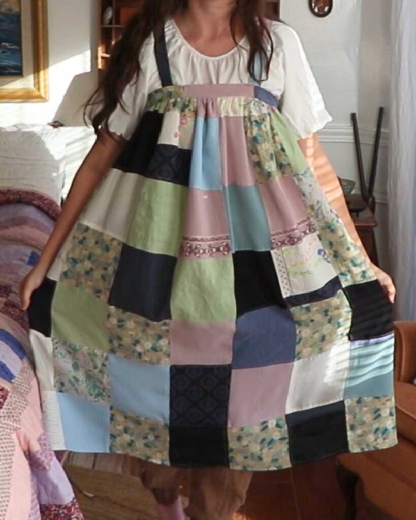 a woman wearing a patchwork dress