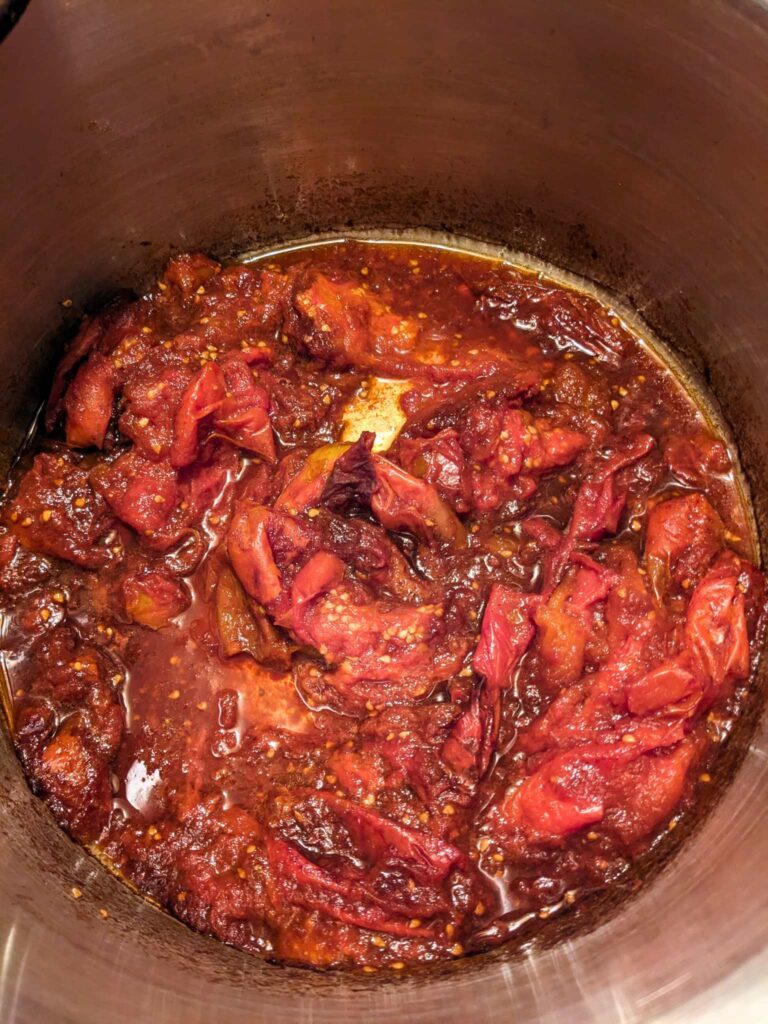 whole tomatoes breaking down as they cook