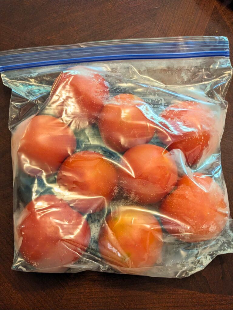 a gallon bag full of frozen tomatoes