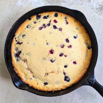 blueberry cornbread in a cast iron skillet