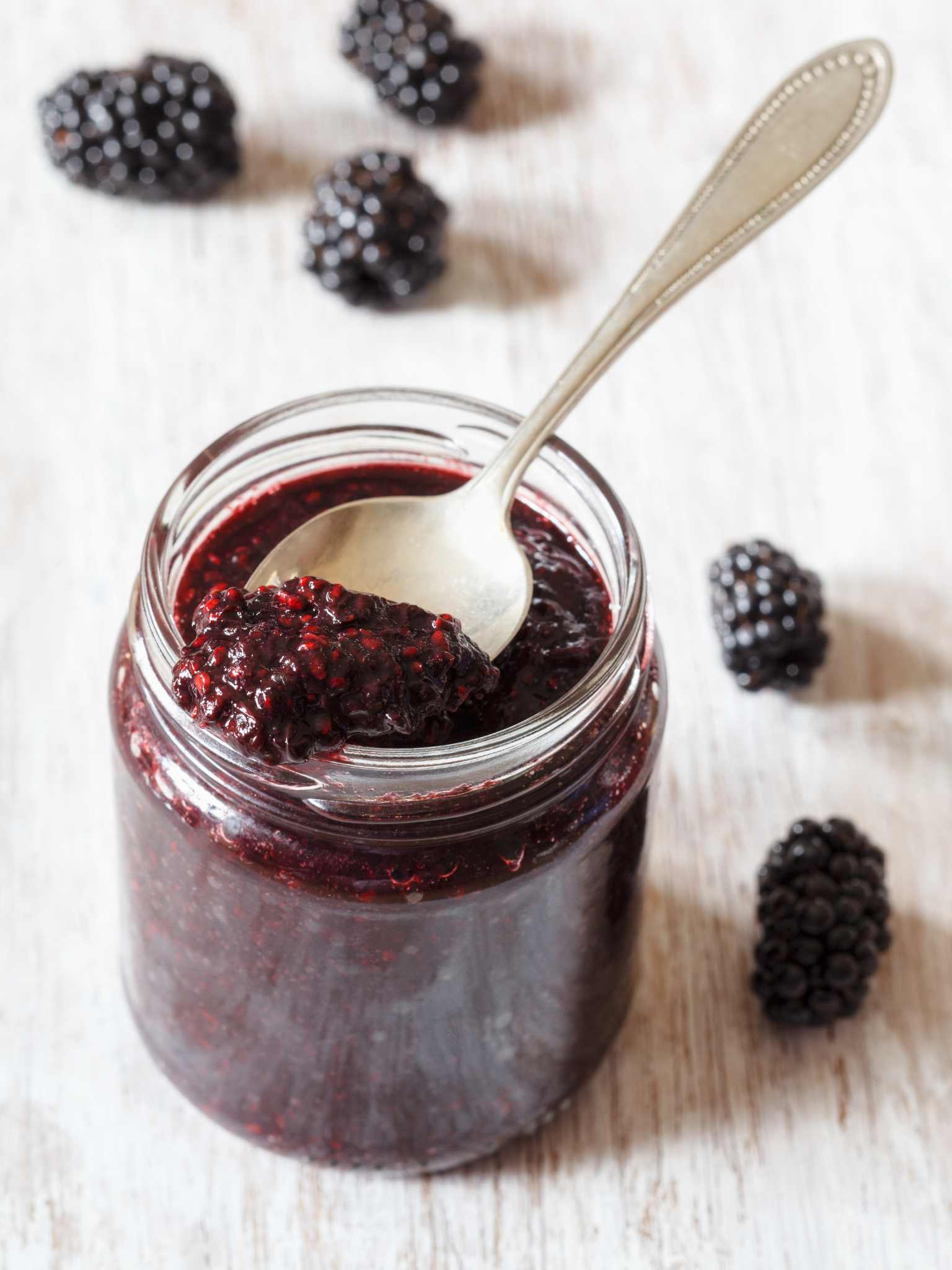 an open jar of seeded blackberry jam